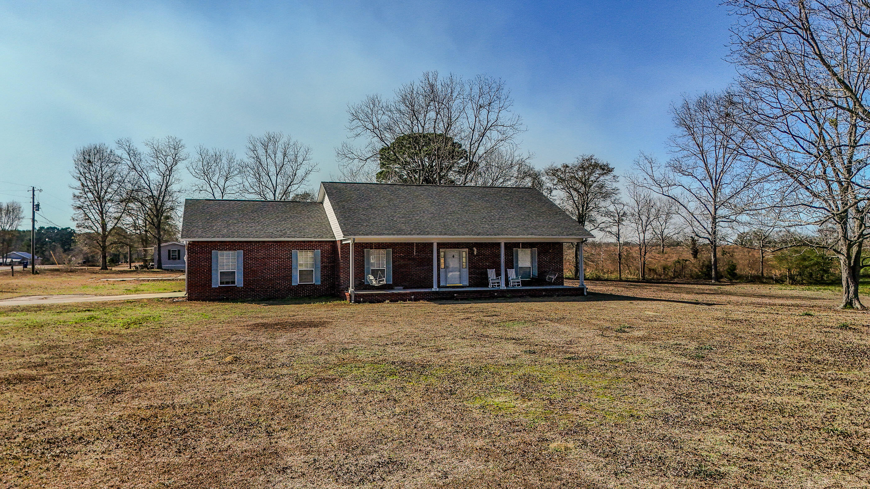 1333 Parrish Road Florala, AL 36442 - Photo 48 of 48 a house with trees in front of it
