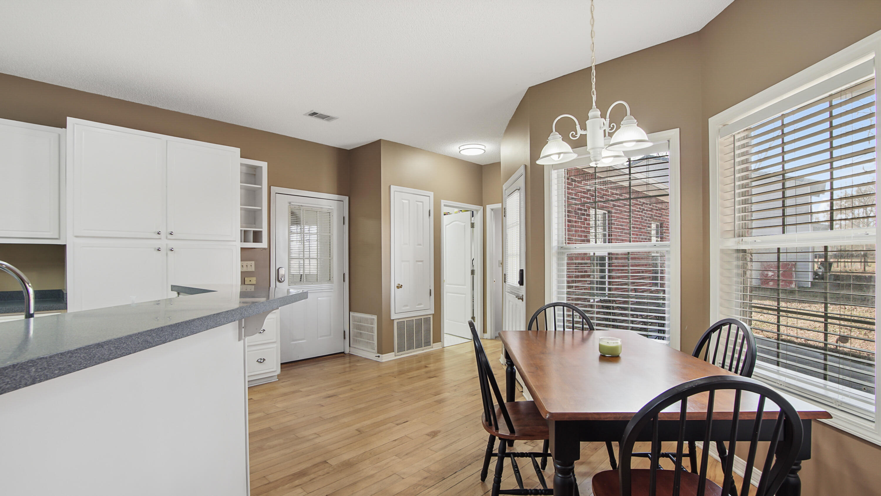 1333 Parrish Road Florala, AL 36442 - Photo 8 of 48 a view of a dining room with furniture a chandelier and wooden floor
