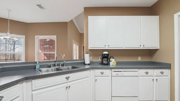 a kitchen with a sink and cabinets