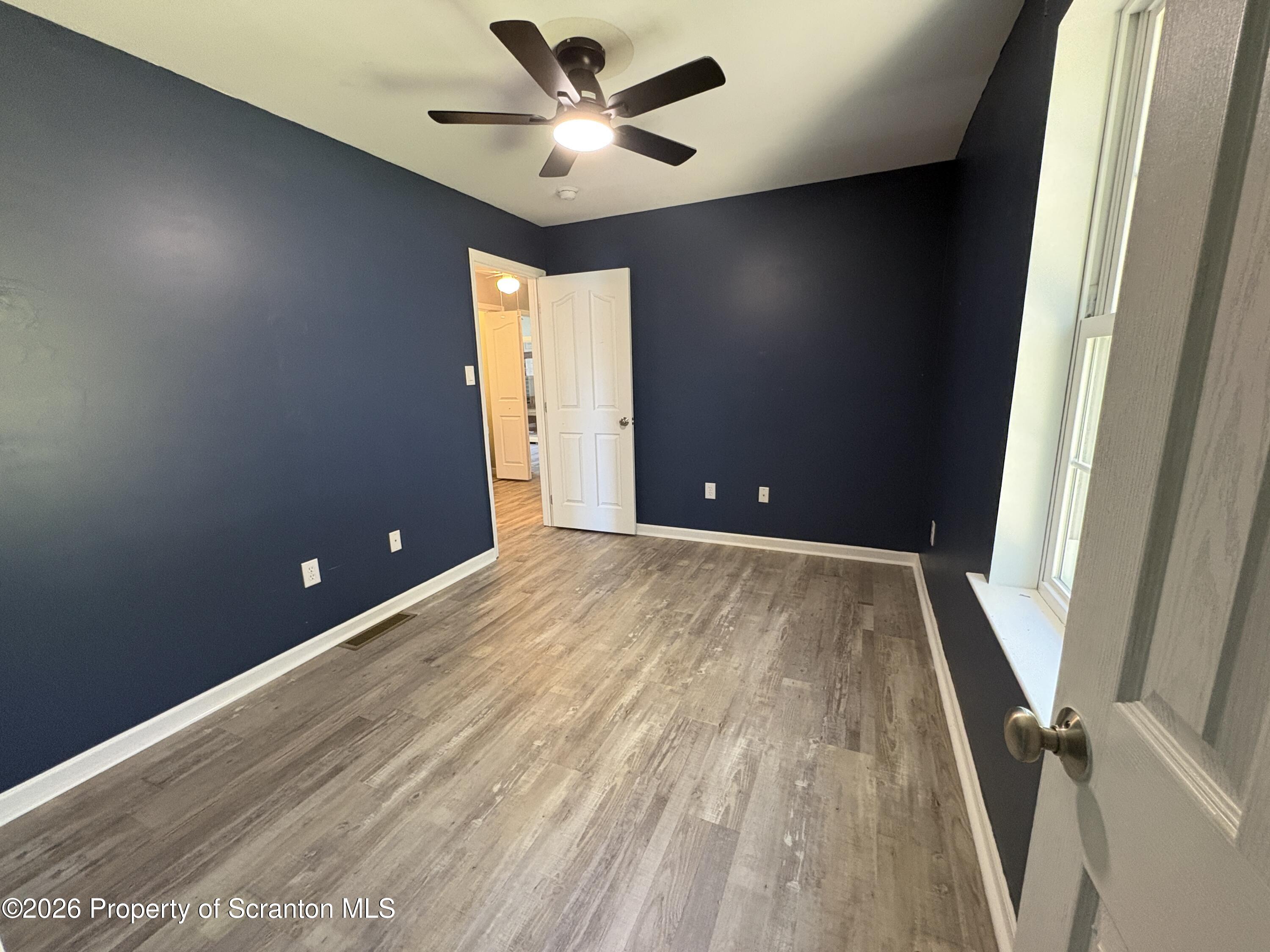 155 Baylor Road Nicholson, PA 18446 - Photo 45 of 53 wooden floor in an empty room with a window
