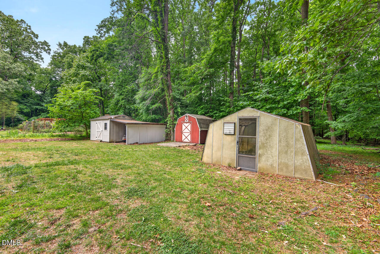 1420 Goodwin Road Durham, NC 27712 - Photo 45 of 54 a house with trees in the background