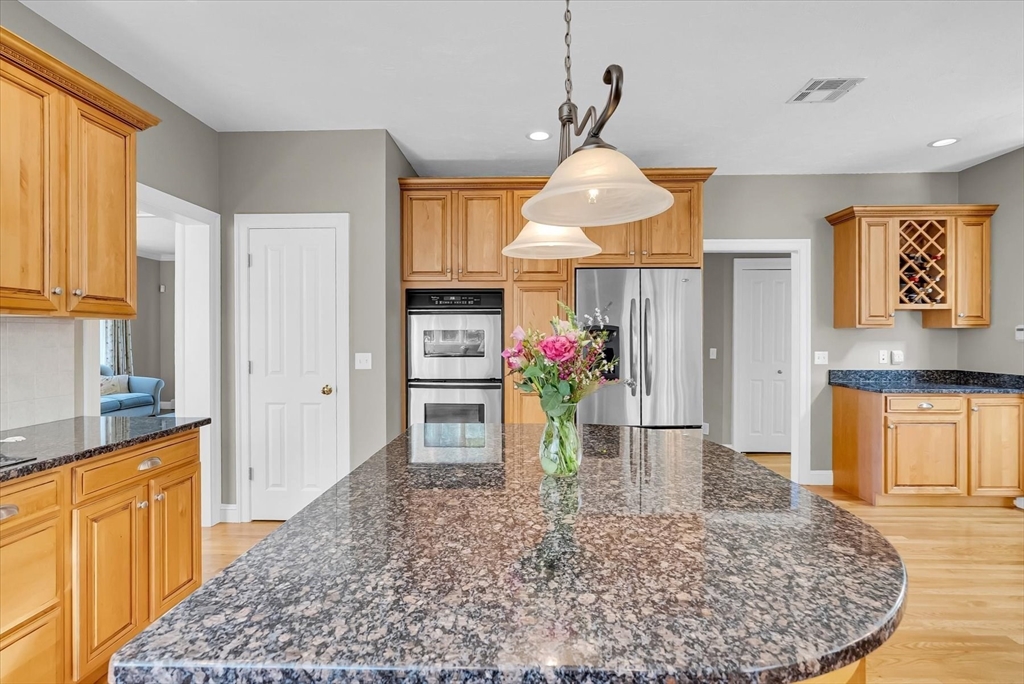 9 Juniper Road Upton, MA 01568 - Photo 11 of 42 a view of a kitchen with cabinets and wooden floor