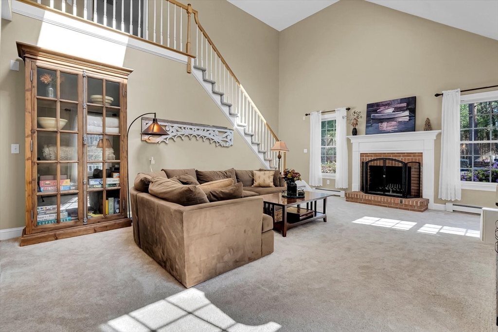 9 Juniper Road Upton, MA 01568 - Photo 14 of 42 a living room with furniture and a fireplace