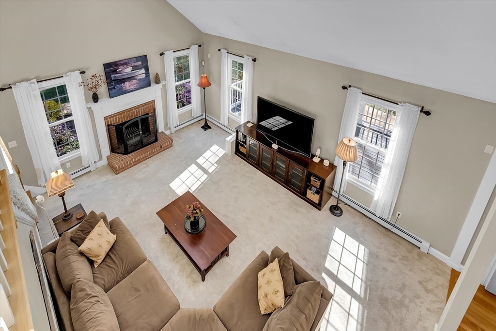 9 Juniper Road Upton, MA 01568 - Photo 17 of 42 a living room with furniture and a flat screen tv