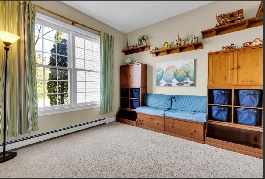 9 Juniper Road Upton, MA 01568 - Photo 19 of 42 a living room with furniture and a window