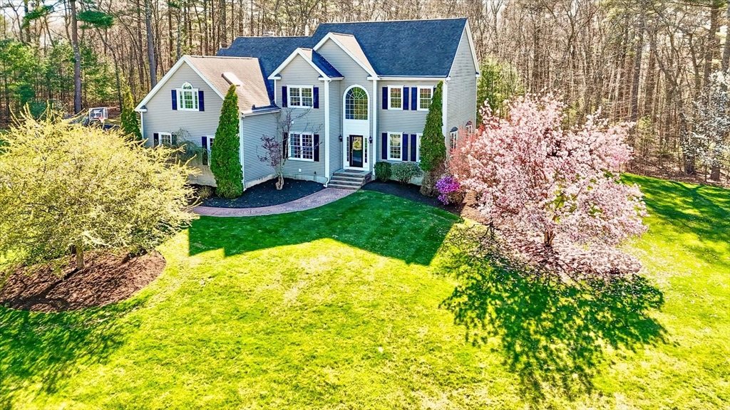 9 Juniper Road Upton, MA 01568 - Photo 2 of 42 a front view of a house with garden