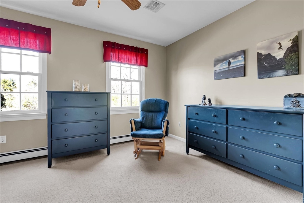 9 Juniper Road Upton, MA 01568 - Photo 21 of 42 a room with a dresser and a window