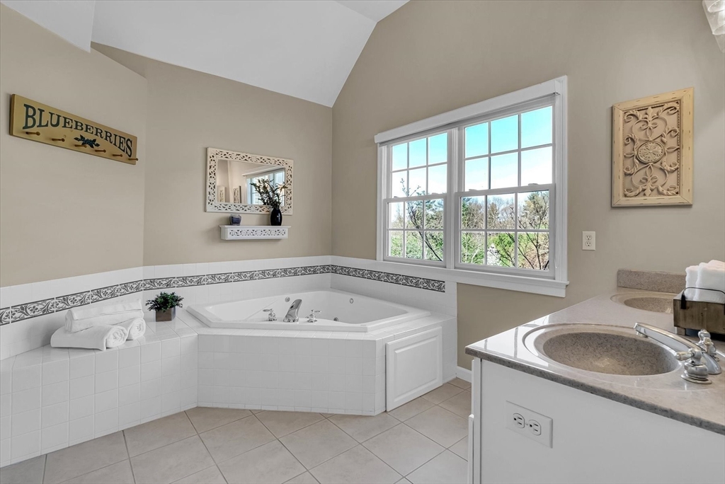 9 Juniper Road Upton, MA 01568 - Photo 31 of 42 a bathroom with a sink a tub and a window