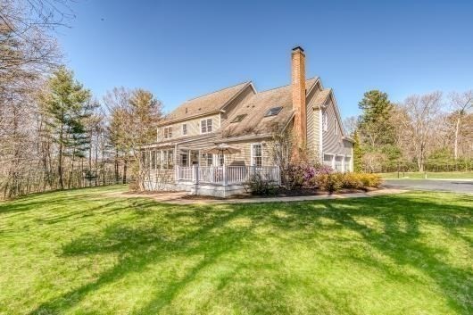 9 Juniper Road Upton, MA 01568 - Photo 37 of 42 a view of a house with a big yard and a large trees