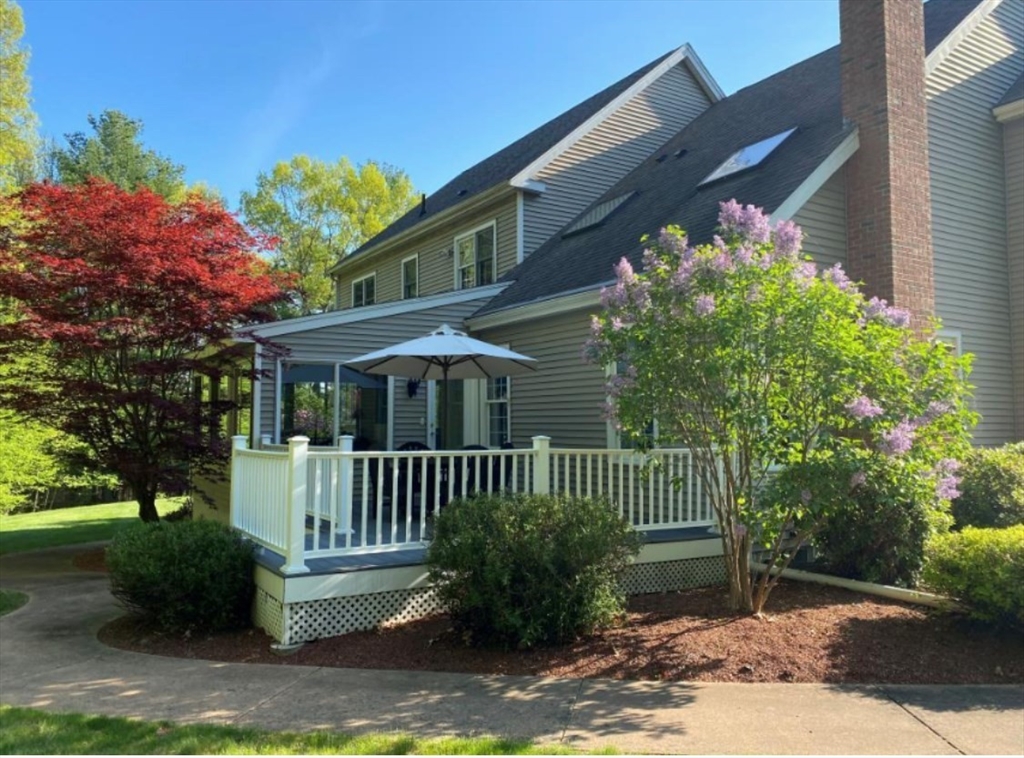 9 Juniper Road Upton, MA 01568 - Photo 41 of 42 a front view of a house with a garden