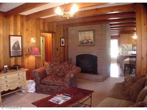 0 Charnel Road Winston-Salem, NC 27127 - Photo 3 of 9 Other. Cozy living room has fireplace with insert and beautiful wood paneling