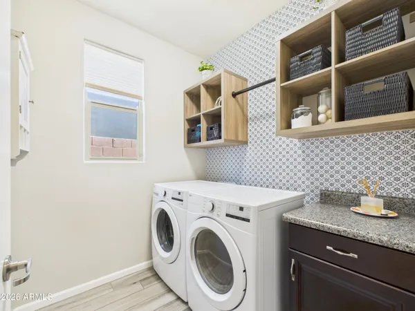 a utility room with dryer and washer