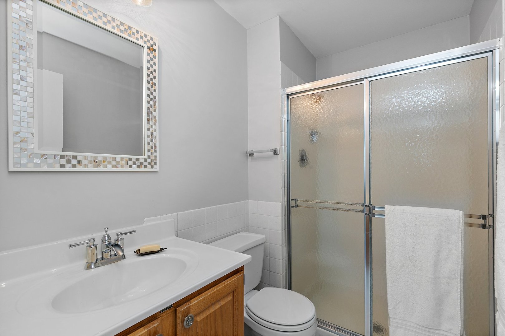 1207 South Old Wilke Road, Unit 409 Rolling Meadows, IL 60005 - Photo 14 of 26 a bathroom with a sink mirror vanity and toilet