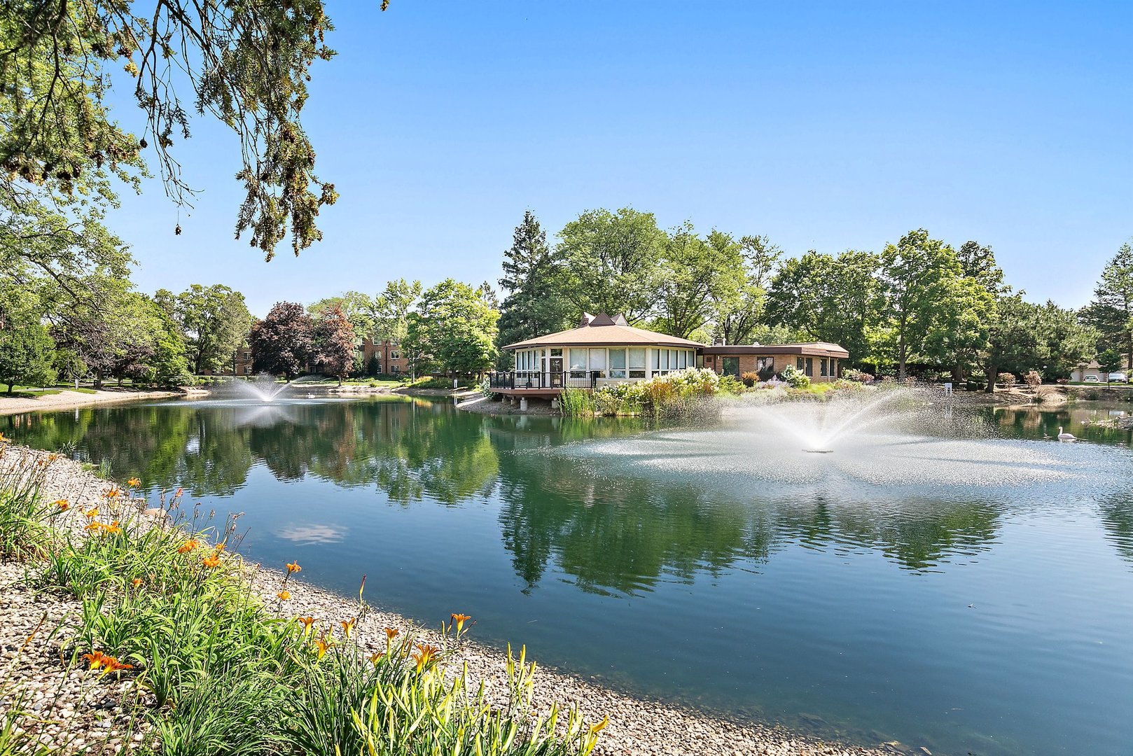 1207 South Old Wilke Road, Unit 409 Rolling Meadows, IL 60005 - Photo 19 of 26 a view of a lake with houses