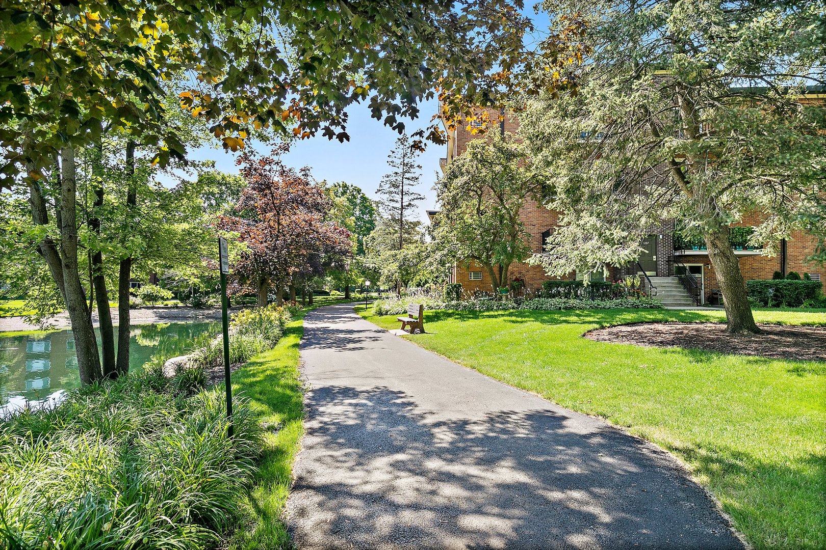 1207 South Old Wilke Road, Unit 409 Rolling Meadows, IL 60005 - Photo 20 of 26 a view of a garden with trees