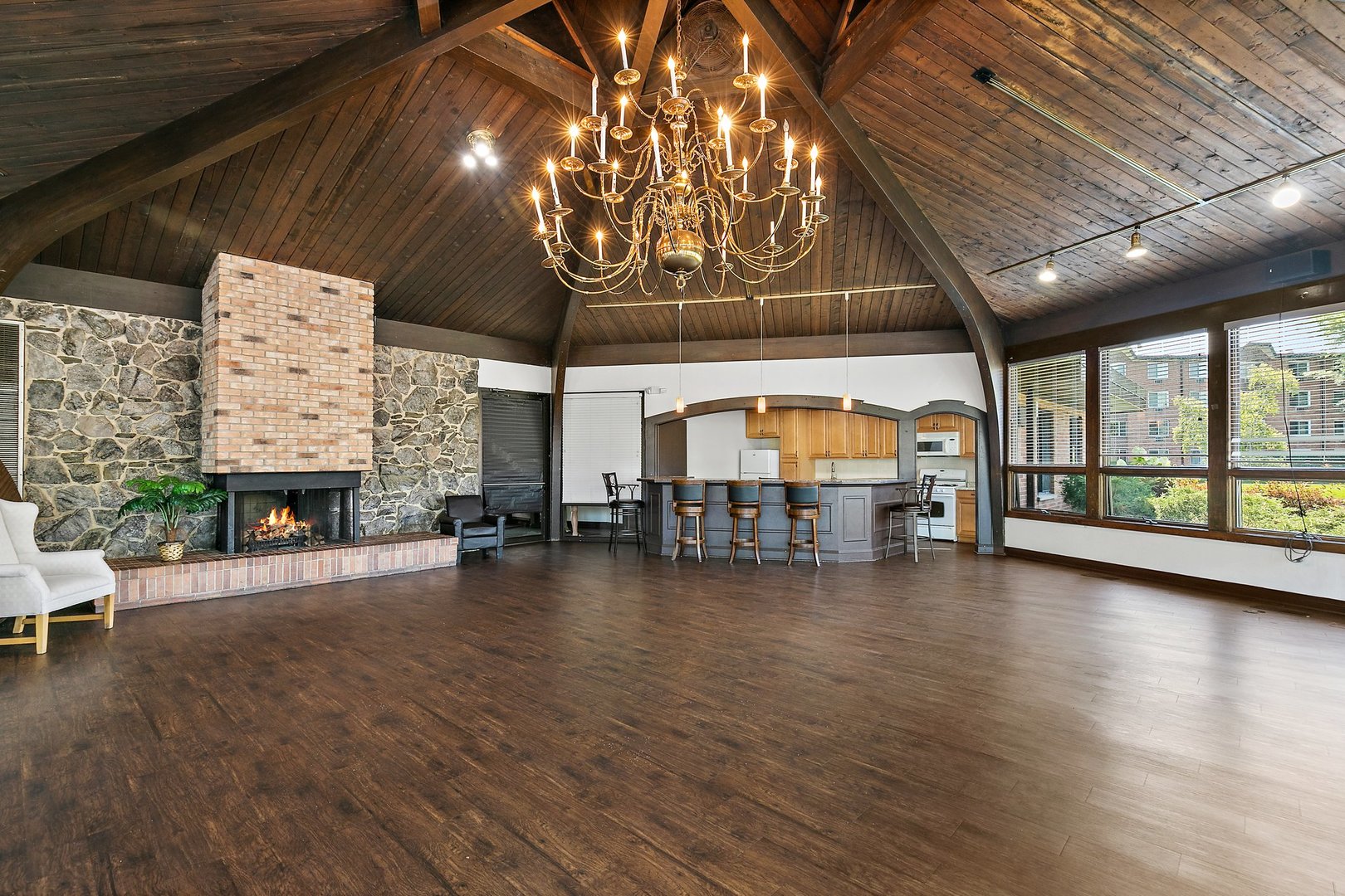 1207 South Old Wilke Road, Unit 409 Rolling Meadows, IL 60005 - Photo 22 of 26 a view of a hall with a fireplace and a table