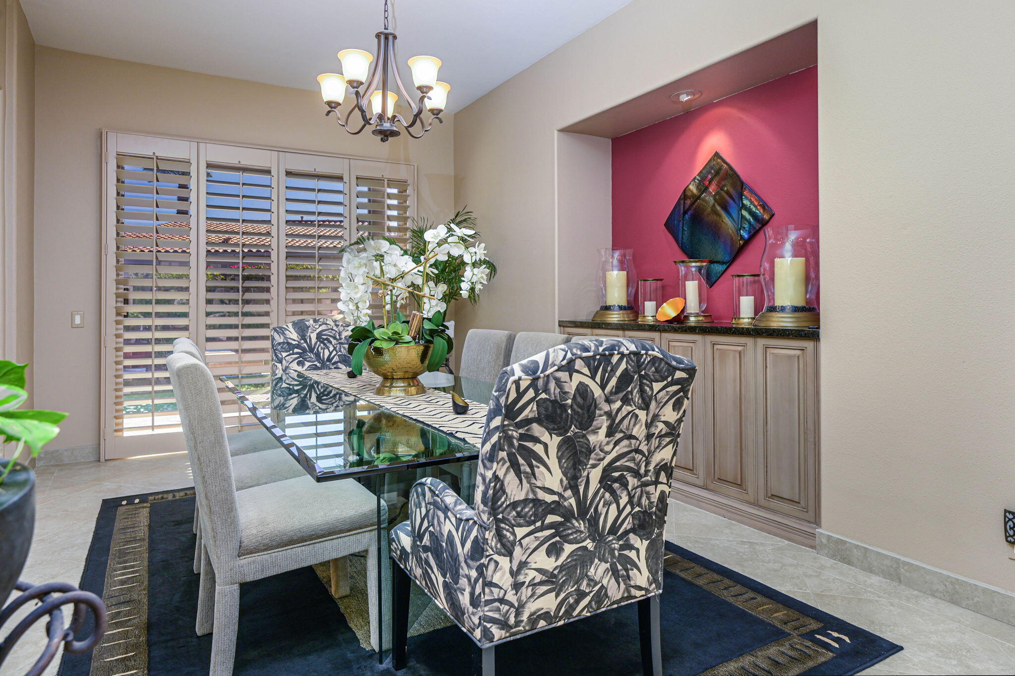 328 Tomahawk Drive Palm Desert, CA 92211 - Photo 14 of 56 a view of a dining room with furniture wooden floor and a chandelier