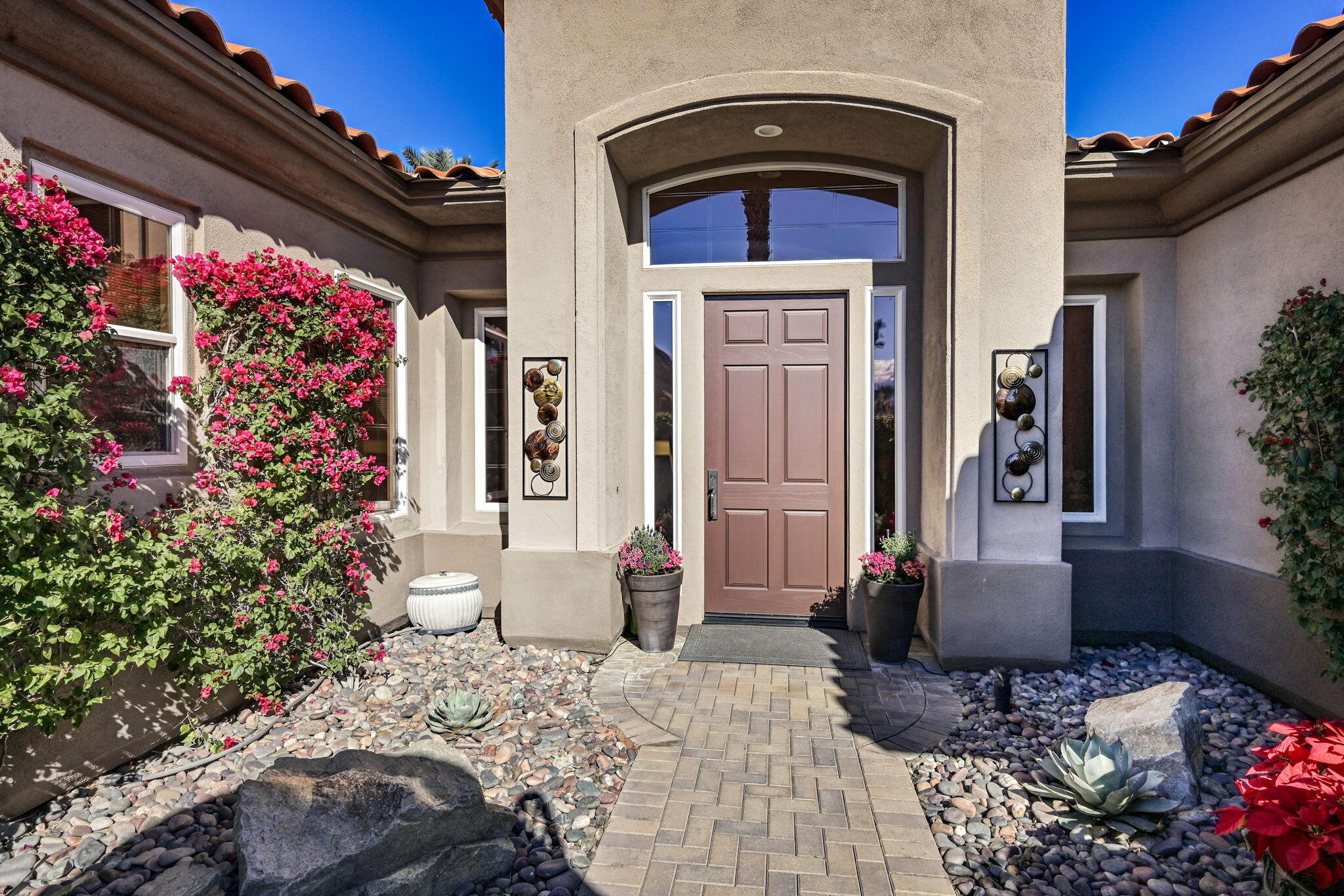328 Tomahawk Drive Palm Desert, CA 92211 - Photo 2 of 56 a front view of a house