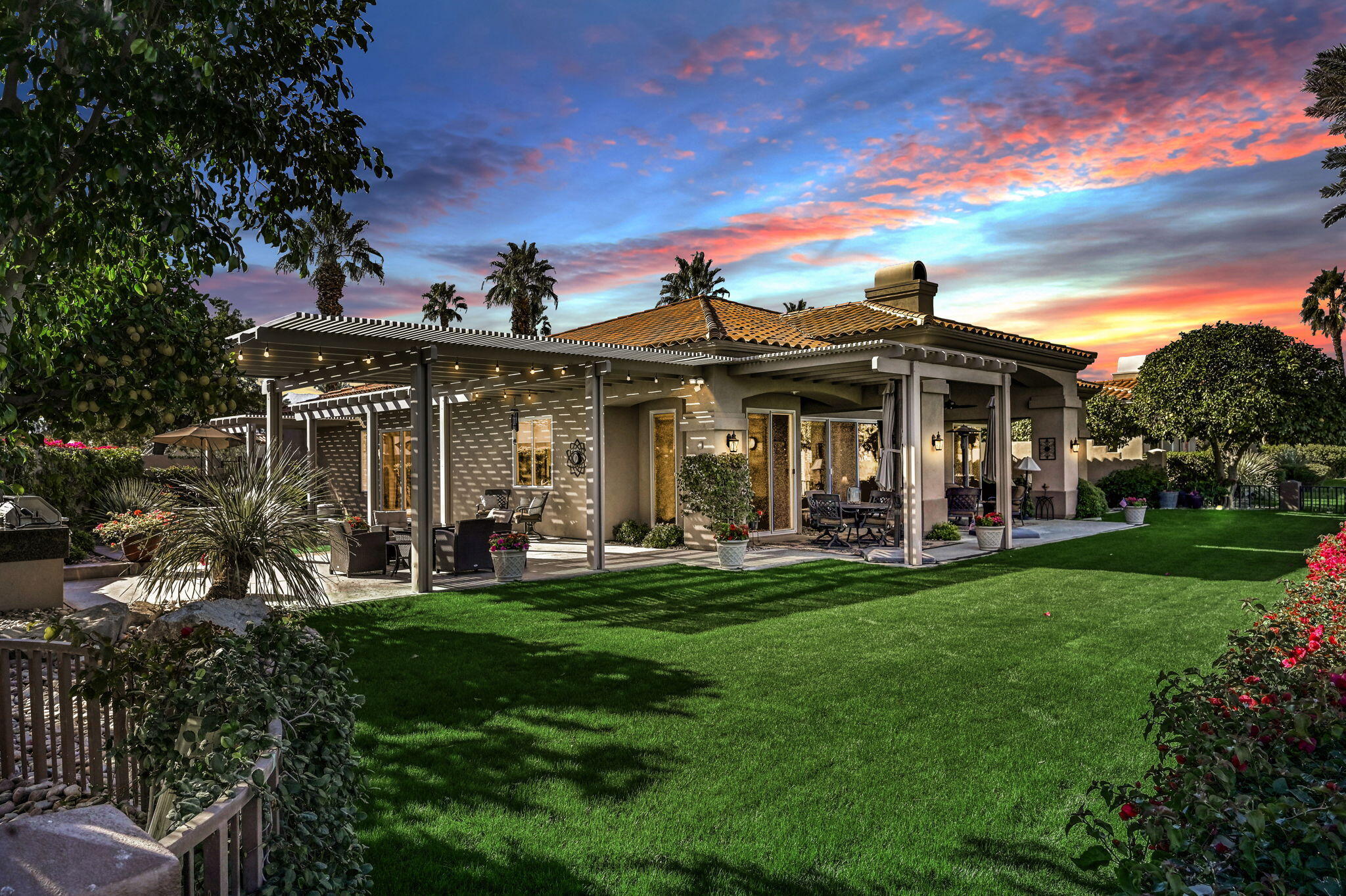 328 Tomahawk Drive Palm Desert, CA 92211 - Photo 40 of 56 a front view of a house with swimming pool having outdoor seating