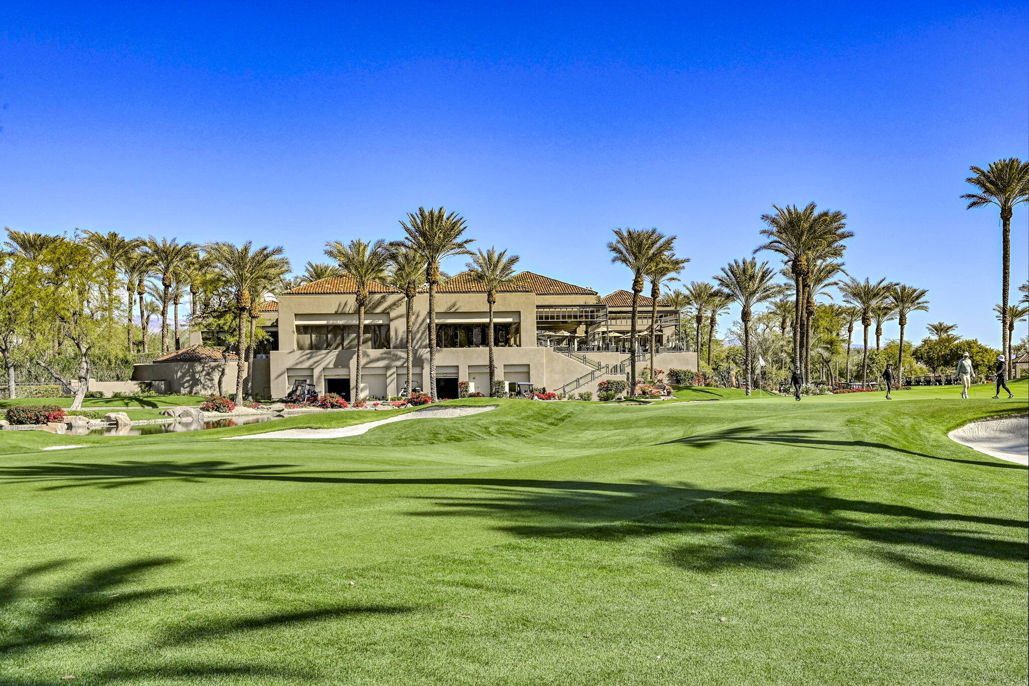 328 Tomahawk Drive Palm Desert, CA 92211 - Photo 42 of 56 a front view of a building and a big yard
