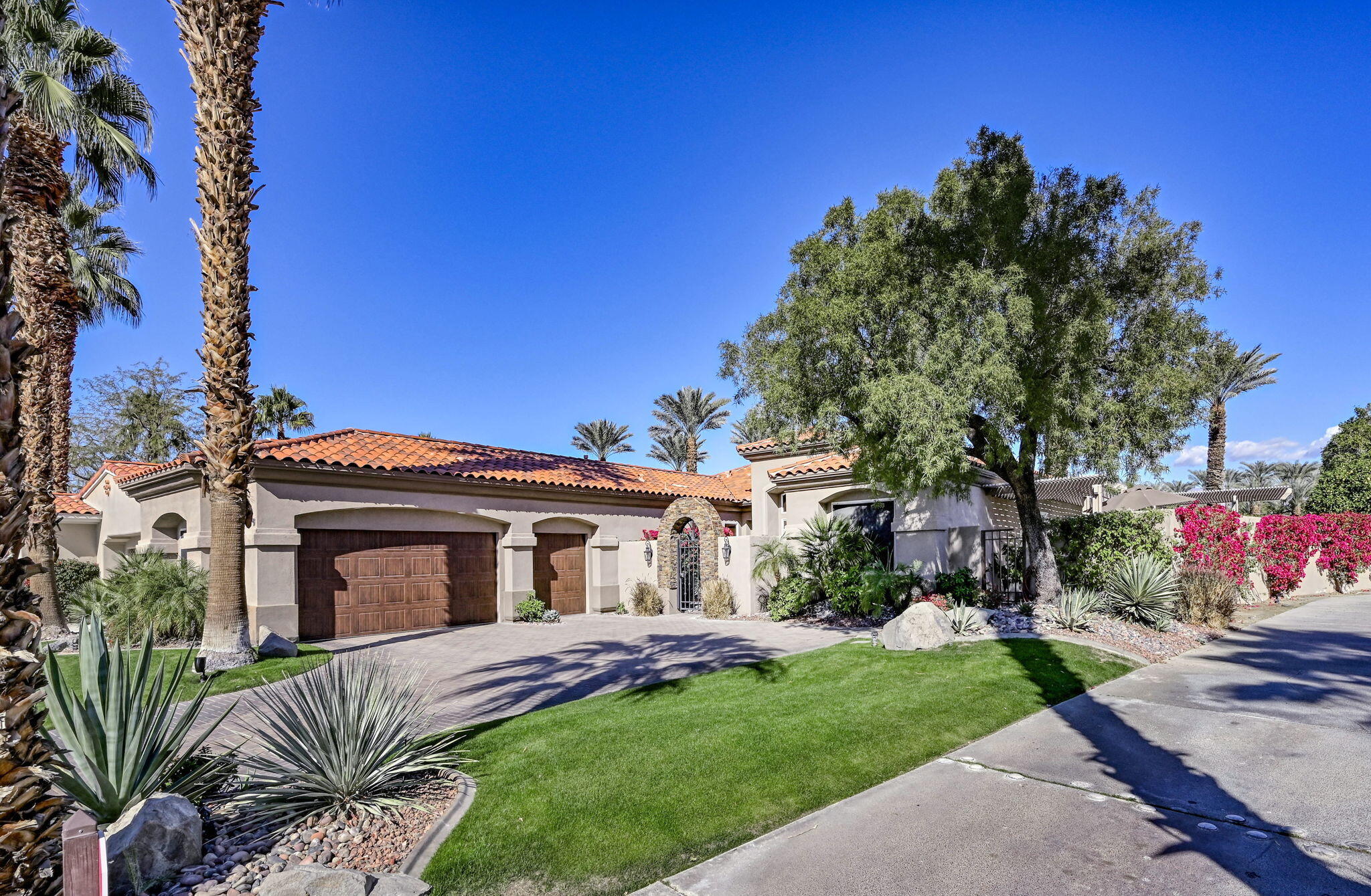 328 Tomahawk Drive Palm Desert, CA 92211 - Photo 45 of 56 a view of a house with a garden