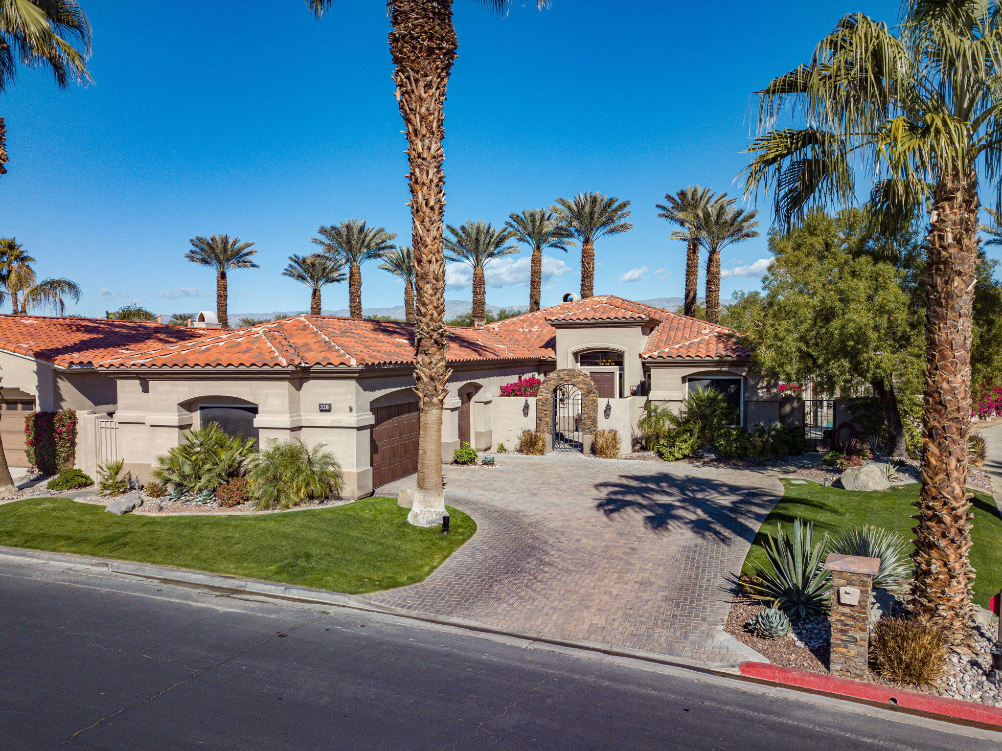 328 Tomahawk Drive Palm Desert, CA 92211 - Photo 52 of 56 a front view of a house with garden