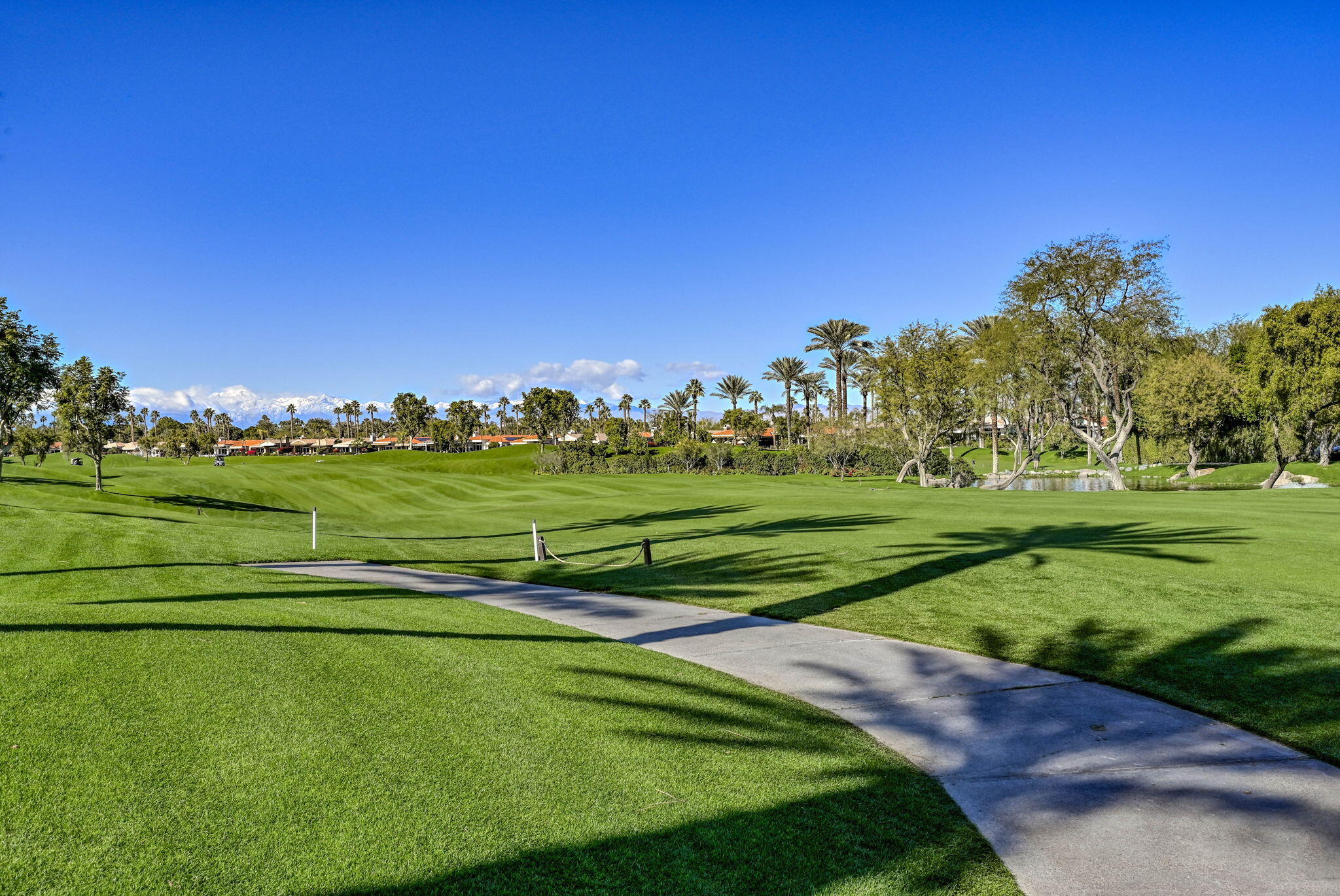 328 Tomahawk Drive Palm Desert, CA 92211 - Photo 54 of 56 a view of a golf course with a lake