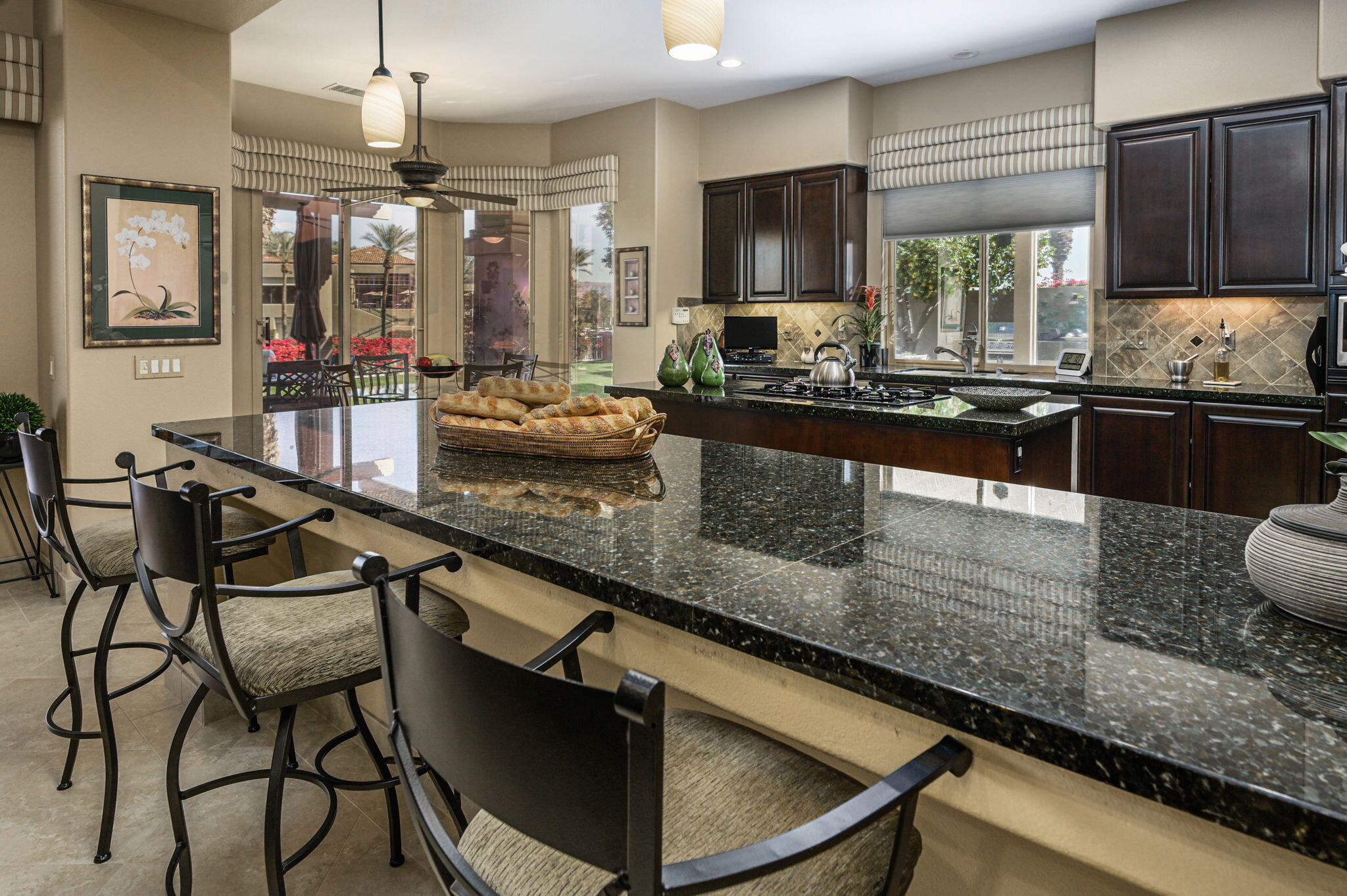 328 Tomahawk Drive Palm Desert, CA 92211 - Photo 9 of 56 a kitchen with stainless steel appliances granite countertop a sink and a counter space