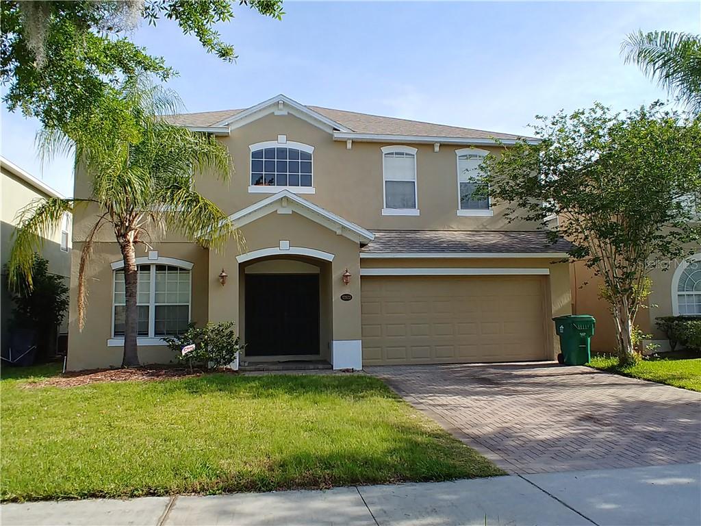 12923 Grovehurst Avenue Winter Garden, FL 34787 - Photo 1 of 1 a front view of a house with a yard and garage