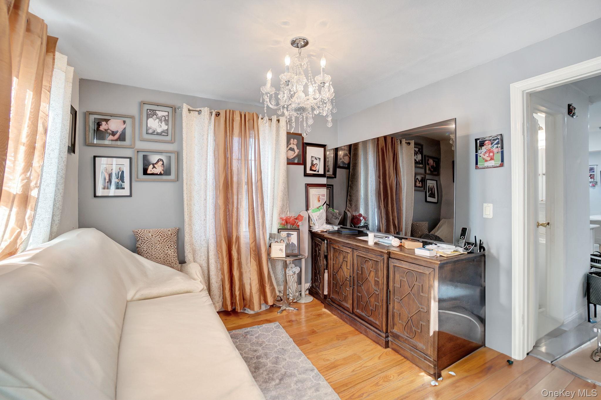 91 Cedar Road Amityville, NY 11701 - Photo 15 of 30 a view of a bedroom with window and furniture