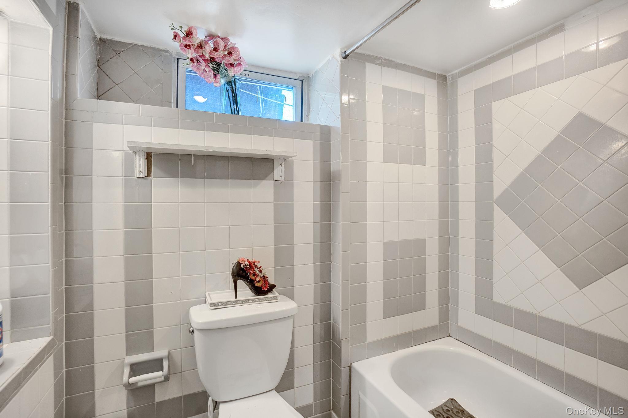 91 Cedar Road Amityville, NY 11701 - Photo 23 of 30 a living room with a couch and a table