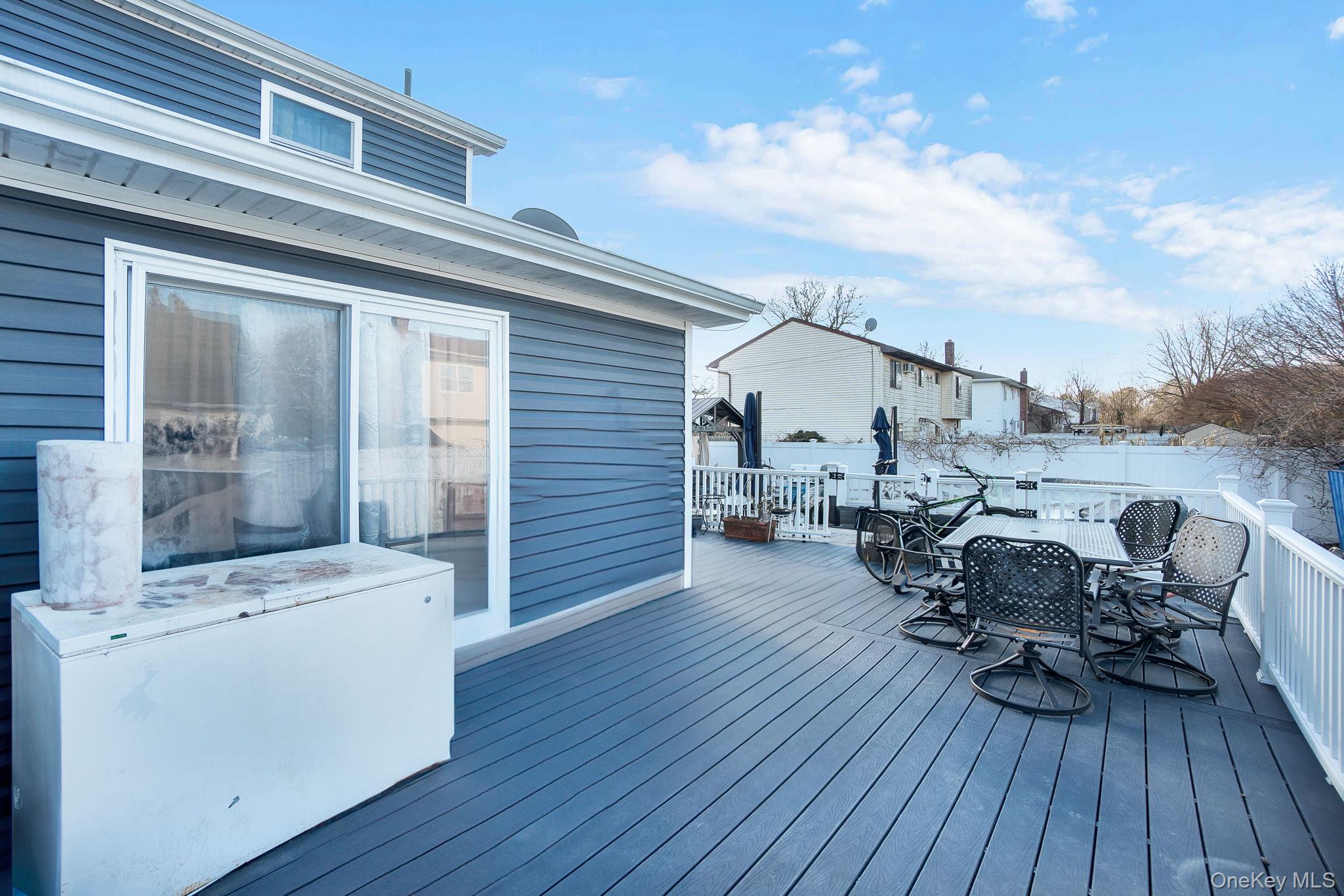 91 Cedar Road Amityville, NY 11701 - Photo 26 of 30 a view of a terrace with seating area