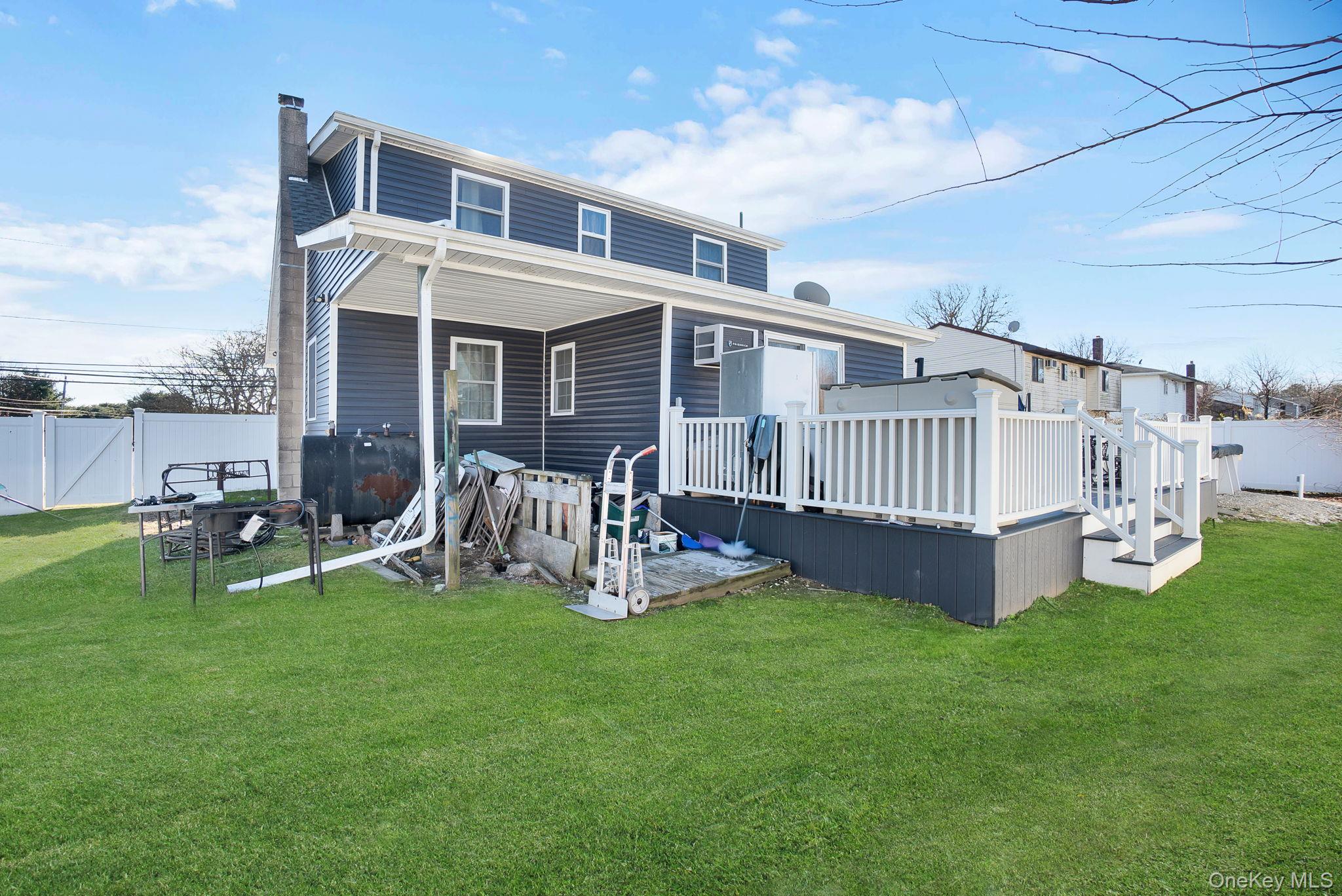 91 Cedar Road Amityville, NY 11701 - Photo 29 of 30 a view of a house with a yard and sitting area