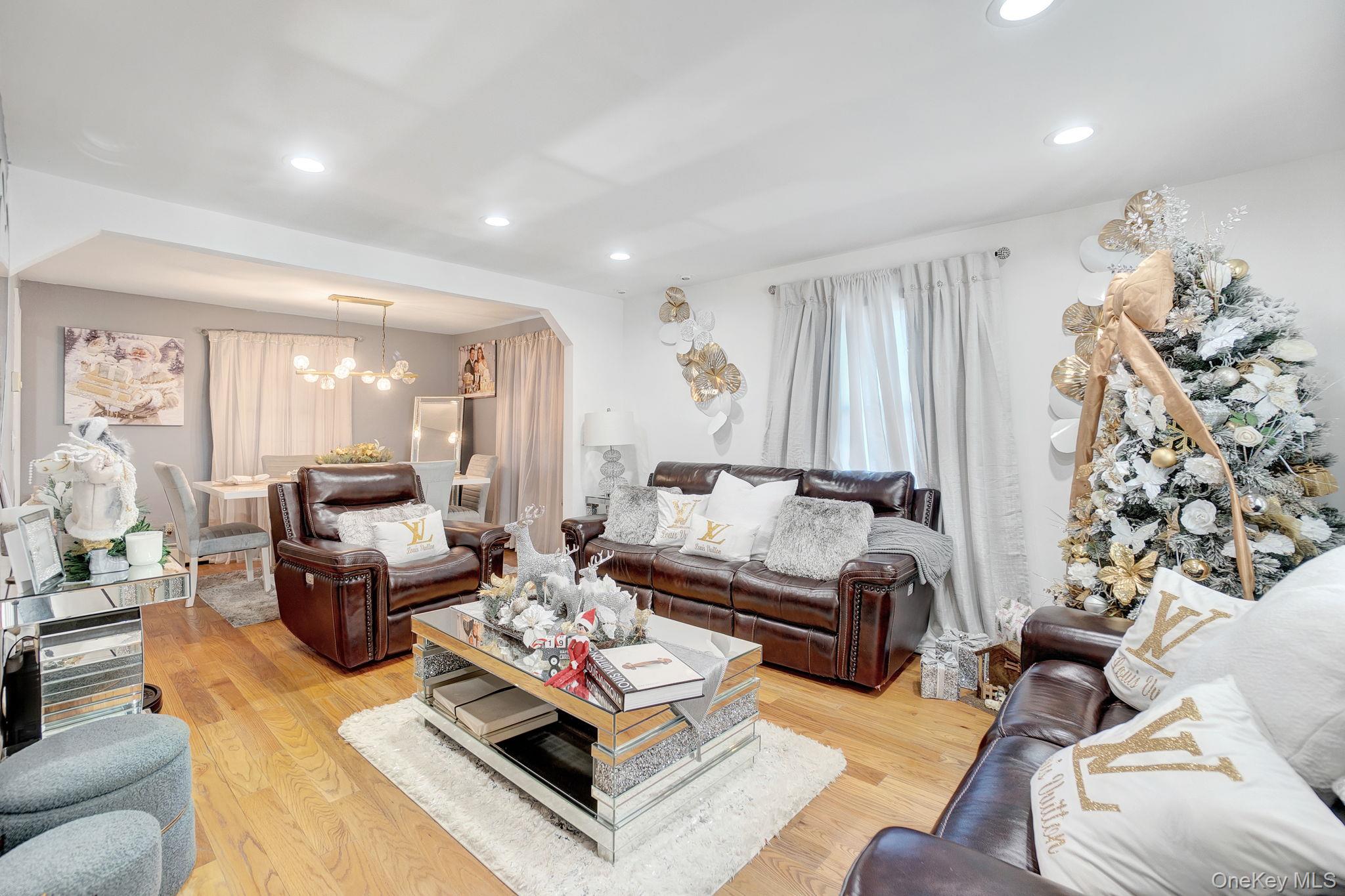 91 Cedar Road Amityville, NY 11701 - Photo 9 of 30 a living room with furniture fireplace and a large window