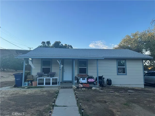 a view of a car park in front of house