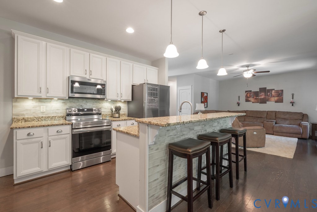 6446 Chestnut Church Road Mechanicsville, VA 23116 - Photo 10 of 49 Kitchen featuring white cabinetry, stainless steel