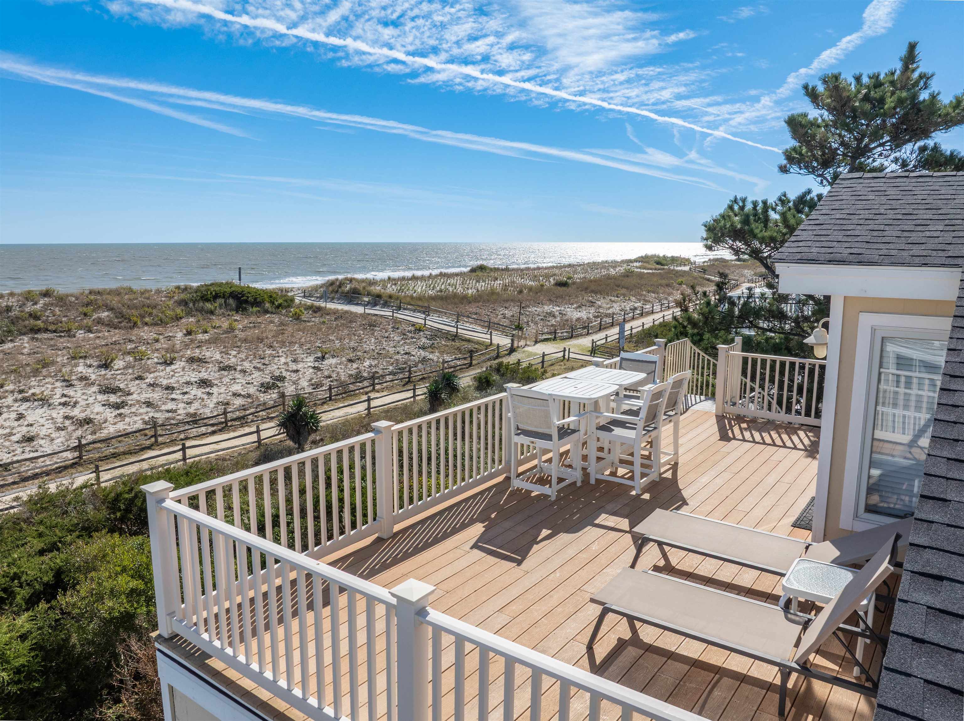 83 13th Street East Avalon, NJ 08202 - Photo 5 of 40 a view of a roof deck with wooden floor and city view