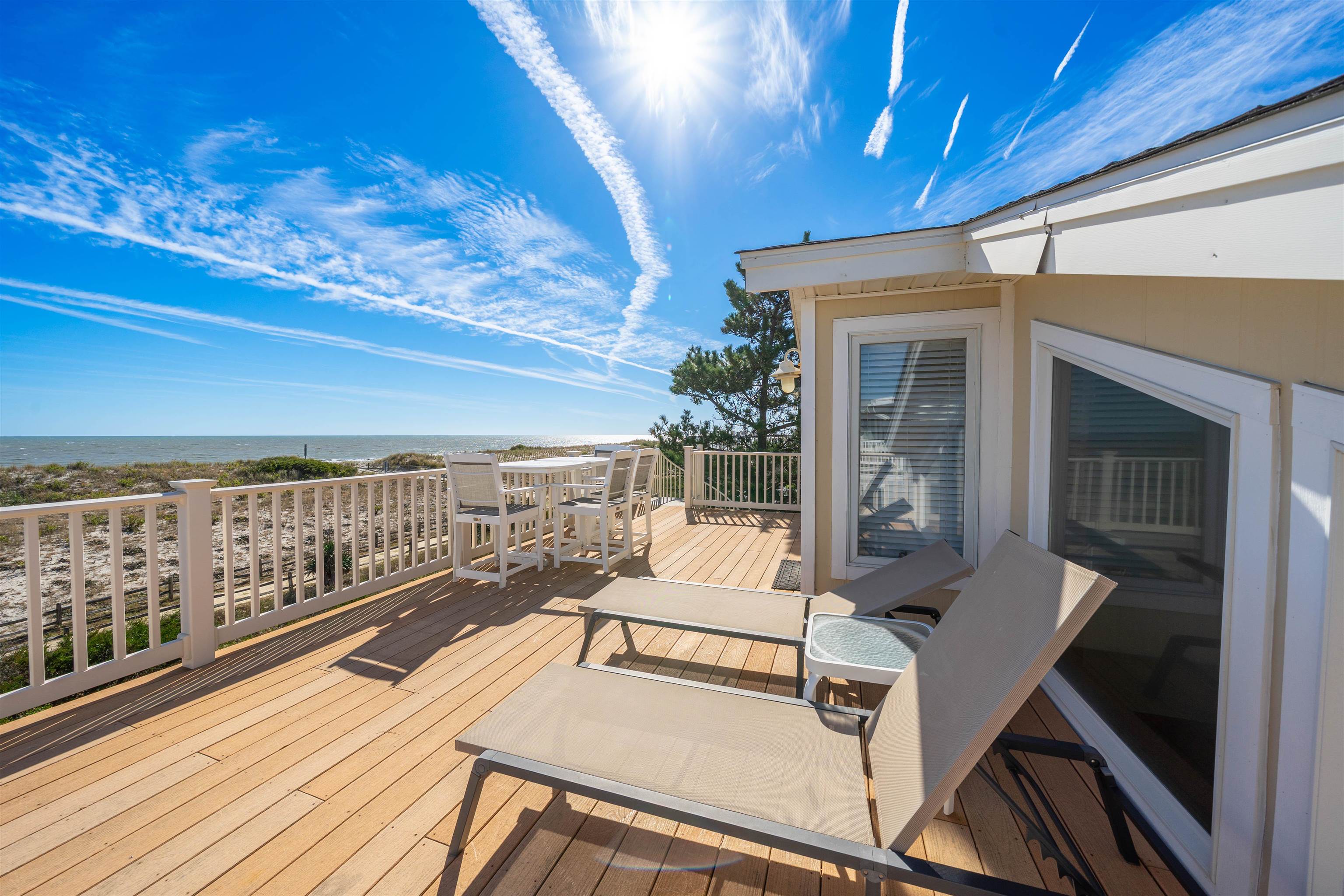 83 13th Street East Avalon, NJ 08202 - Photo 10 of 40 a view of a balcony with wooden floor
