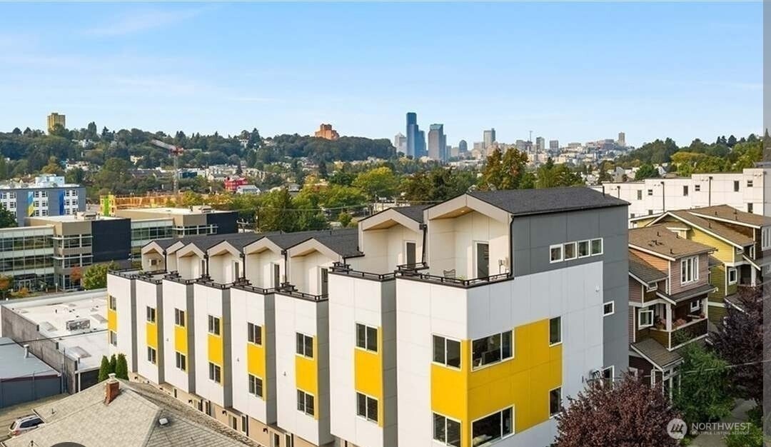 1919 24th Avenue South, Unit D Seattle, WA 98144 - Photo 1 of 35 a view of a large building with a city view
