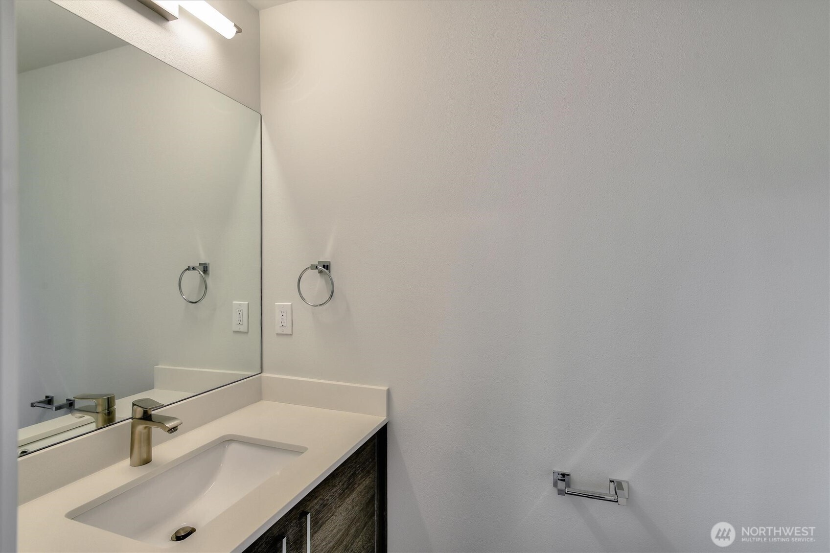 1919 24th Avenue South, Unit D Seattle, WA 98144 - Photo 28 of 35 a bathroom with a sink and vanity