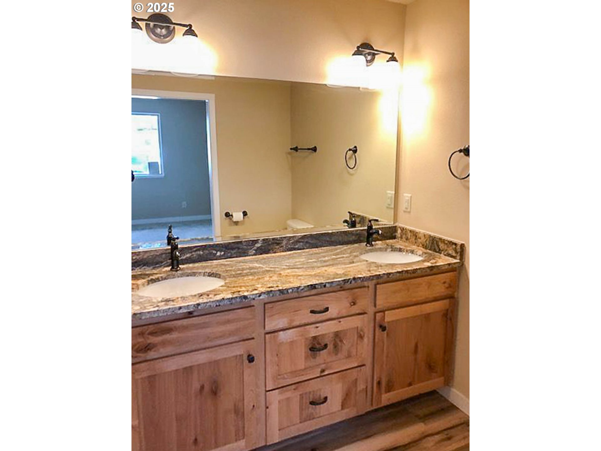 5135 Southwest Grange Road Roseburg, OR 97471 - Photo 20 of 27 a bathroom with a granite countertop sink and a mirror