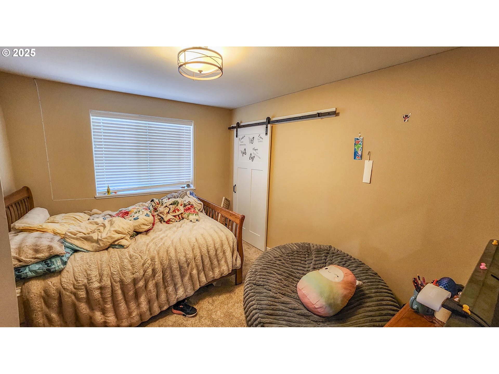 5135 Southwest Grange Road Roseburg, OR 97471 - Photo 25 of 27 a bedroom with a bed and cabinets