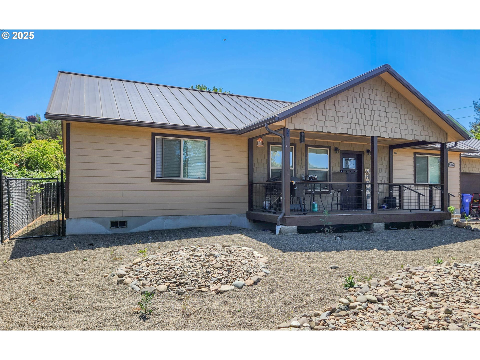 5135 Southwest Grange Road Roseburg, OR 97471 - Photo 4 of 27 a view of a house with a patio