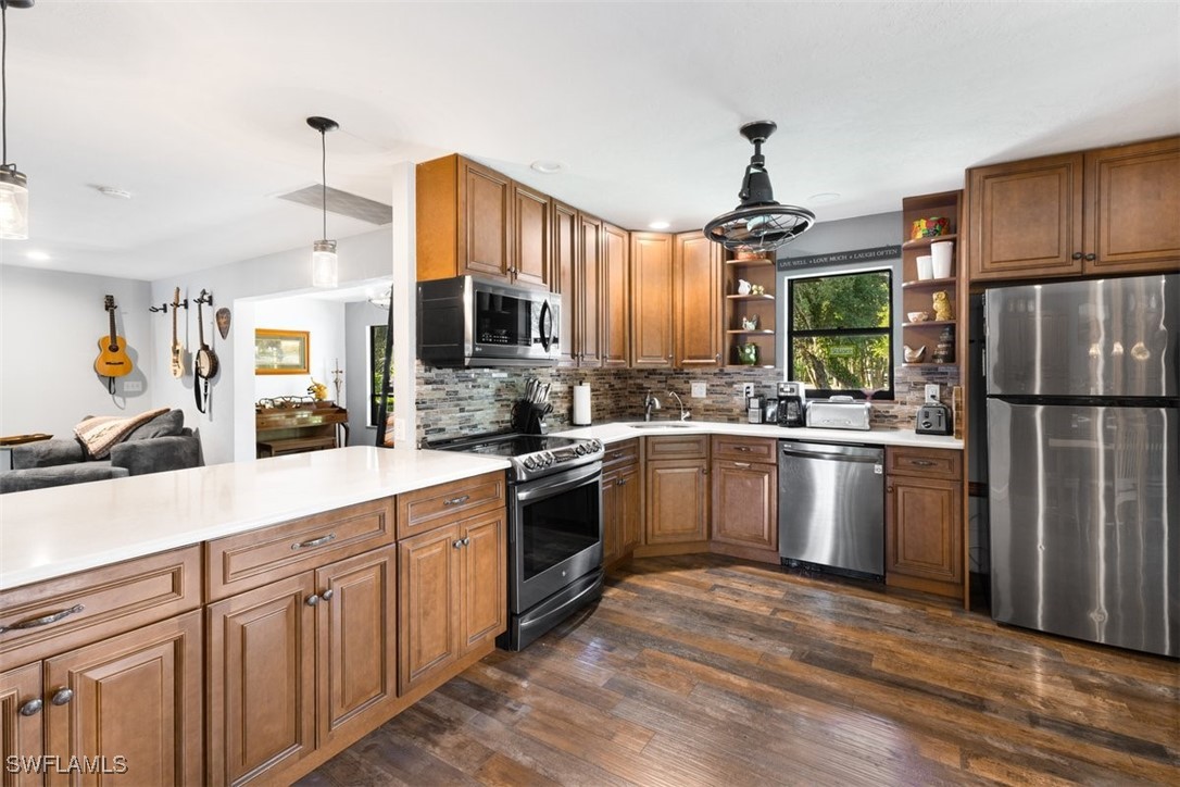 17321 Oak Creek Road Alva, FL 33920 - Photo 30 of 34 a kitchen with a sink stainless steel appliances and window