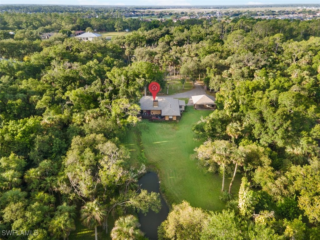 17321 Oak Creek Road Alva, FL 33920 - Photo 4 of 34 a view of a lake with a city