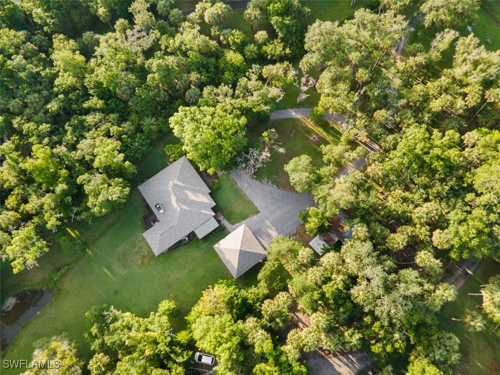 17321 Oak Creek Road Alva, FL 33920 - Photo 7 of 34 an aerial view of a house with a yard and garden