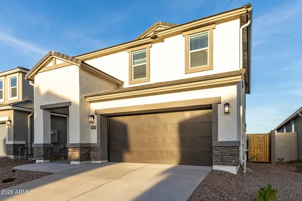 a front view of a house with a garage