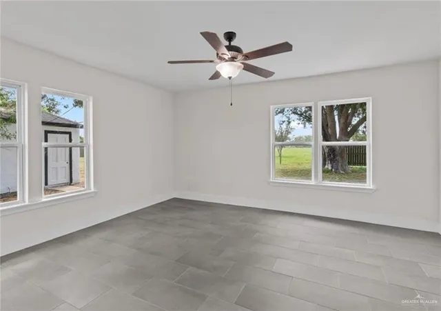 a view of workspace with window and ceiling fan