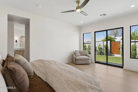 a bedroom with a bed and a couch