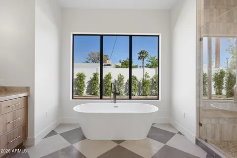 a bathroom with a bathtub and window